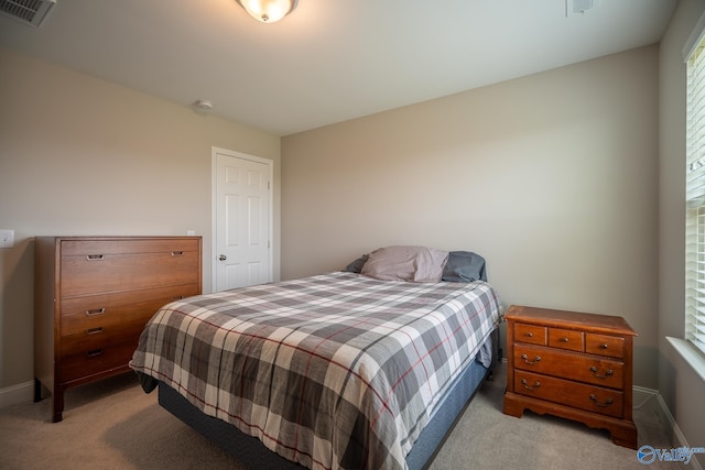 24337 Beacon Cir, Athens, AL 35613 - bedroom with light carpet and baseboards