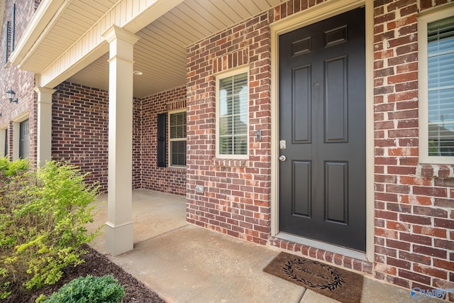 24337 Beacon Cir, Athens, AL 35613 - property entrance featuring covered porch and brick siding
