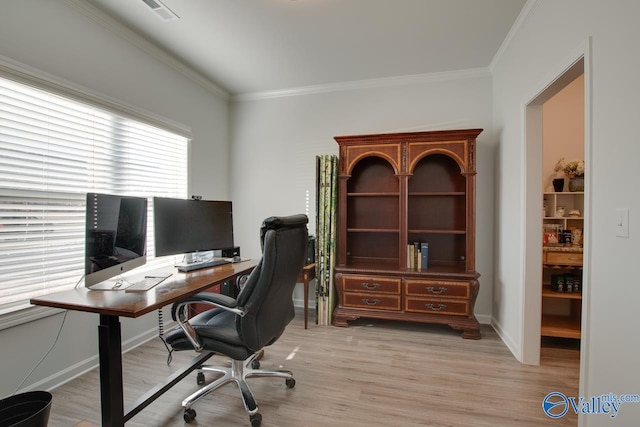 office space featuring ornamental molding and light hardwood / wood-style flooring