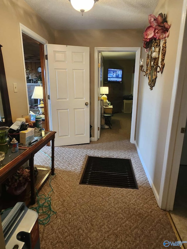 2505 E Broad St, Gadsden, AL 35905 - hallway featuring light carpet, an office area, and a textured ceiling