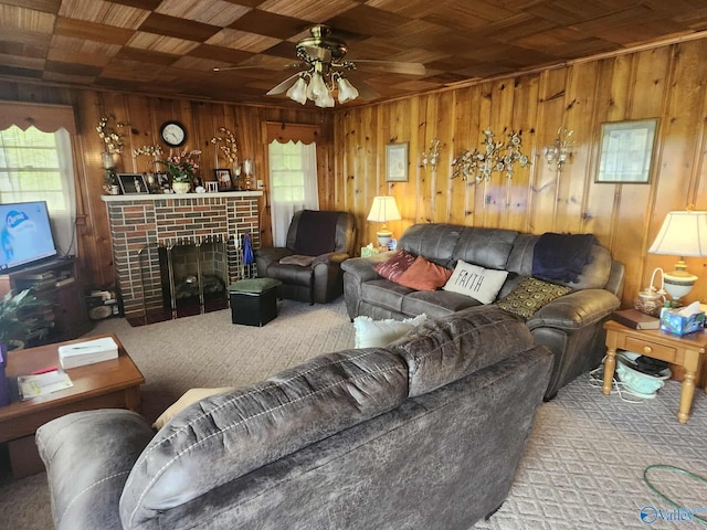 2505 E Broad St, Gadsden, AL 35905 - carpeted living area featuring wood walls, wooden ceiling, ceiling fan, and a brick fireplace