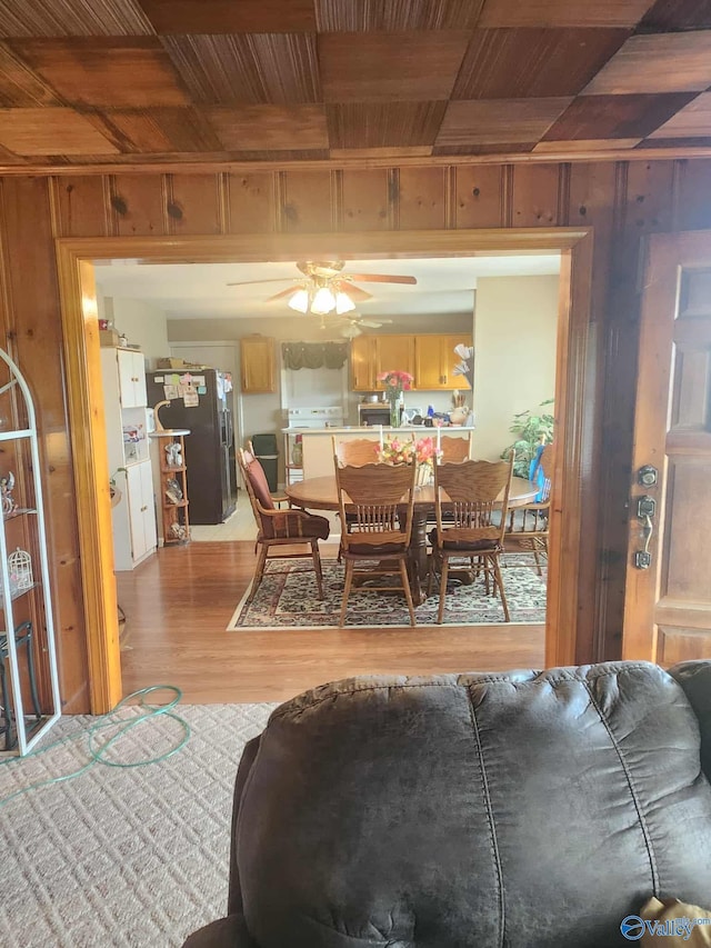 2505 E Broad St, Gadsden, AL 35905 - dining room featuring wooden ceiling, wood walls, wood finished floors, a ceiling fan, and beam ceiling