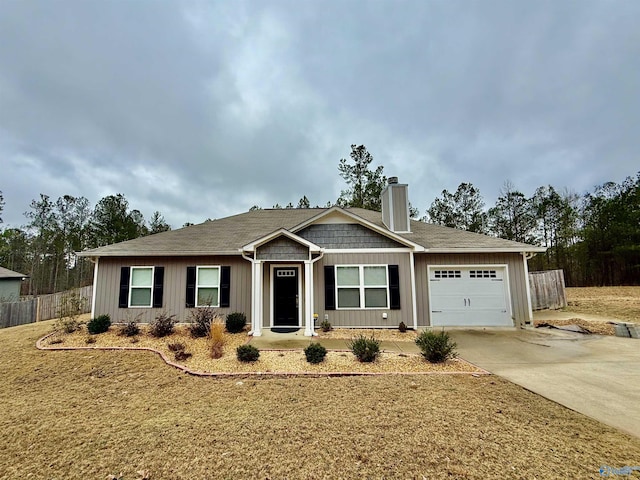 view of front of home with a garage and a front yard