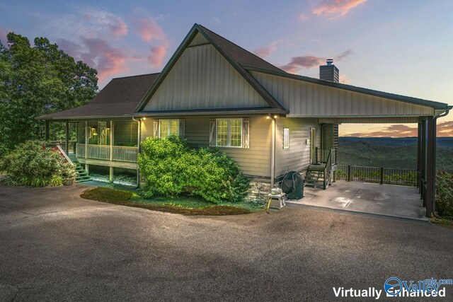 8879 County Road 27, Springville, AL 35146 - view of front of home featuring a chimney, a carport, a porch, driveway, and stairs