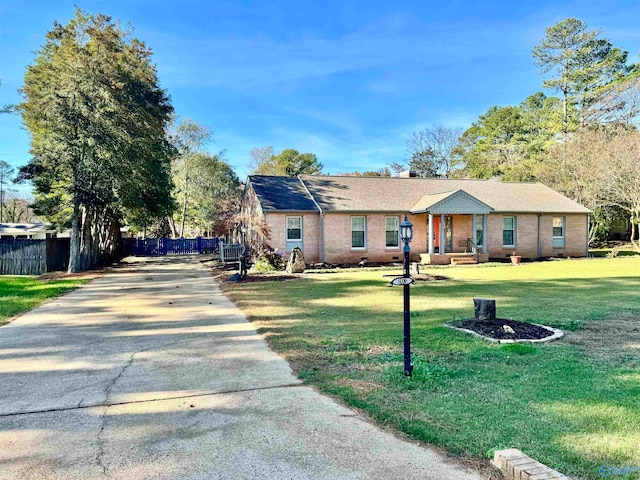 single story home with a front yard