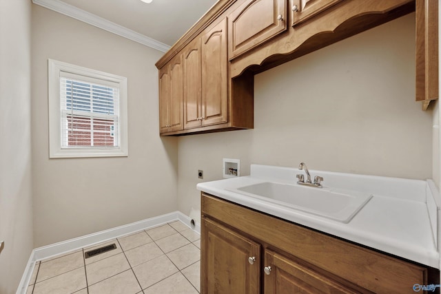 laundry area with hookup for an electric dryer, visible vents, cabinet space, a sink, and baseboards