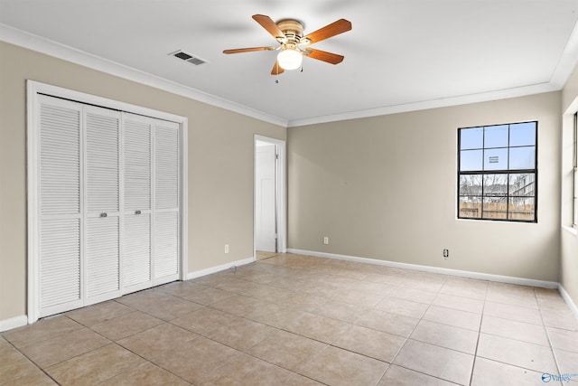 unfurnished bedroom with baseboards, ornamental molding, visible vents, and light tile patterned floors