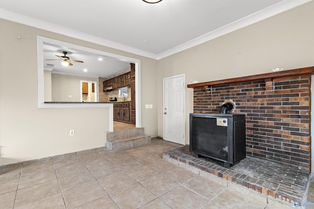 unfurnished living room featuring light tile patterned floors, ceiling fan, and crown molding