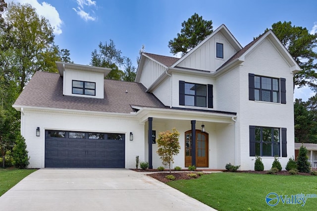 modern farmhouse with a garage, a porch, and a front lawn