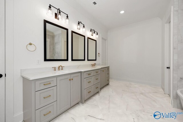 bathroom featuring tile patterned floors and double vanity