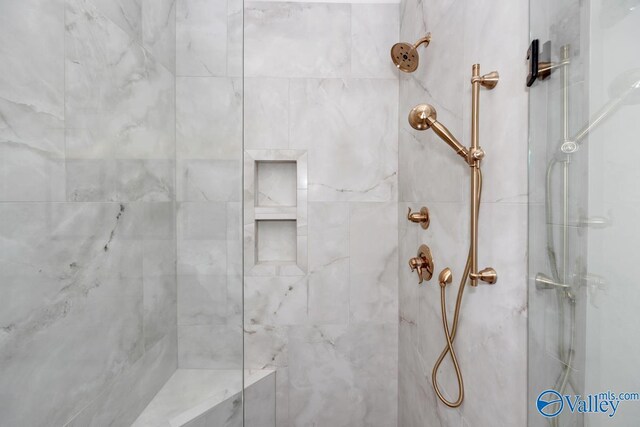 interior space featuring tiled shower