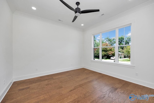 spare room with hardwood / wood-style flooring, ceiling fan, and ornamental molding