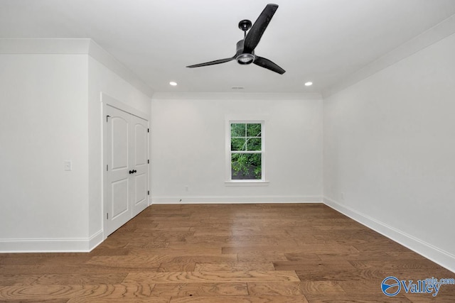 unfurnished room featuring ceiling fan, crown molding, and hardwood / wood-style flooring