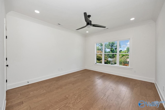 unfurnished room featuring crown molding, ceiling fan, and wood-type flooring