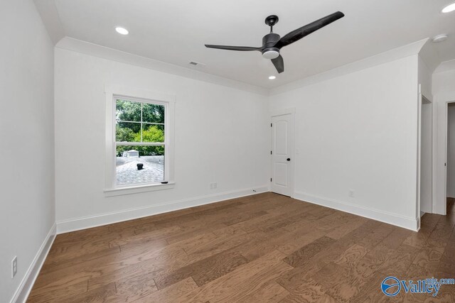 spare room with ornamental molding, hardwood / wood-style flooring, and ceiling fan