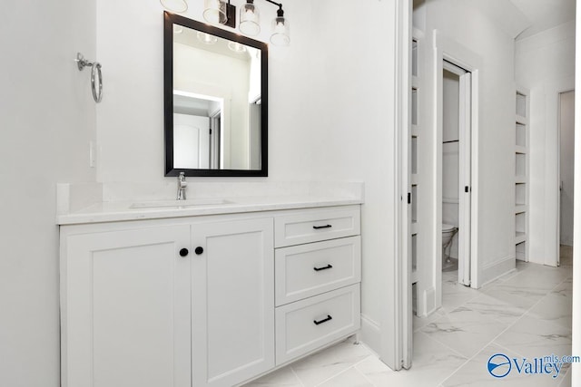 bathroom with vanity and toilet