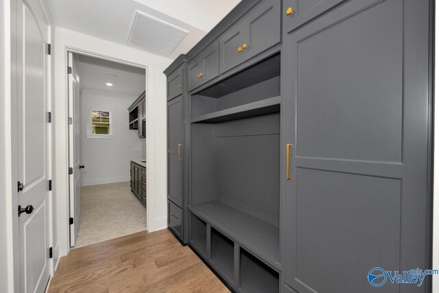 mudroom with light hardwood / wood-style floors