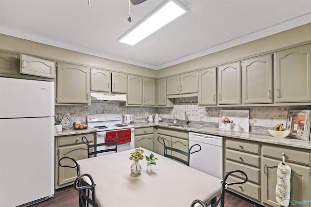 kitchen featuring dark wood finished floors, crown molding, under cabinet range hood, and white appliances