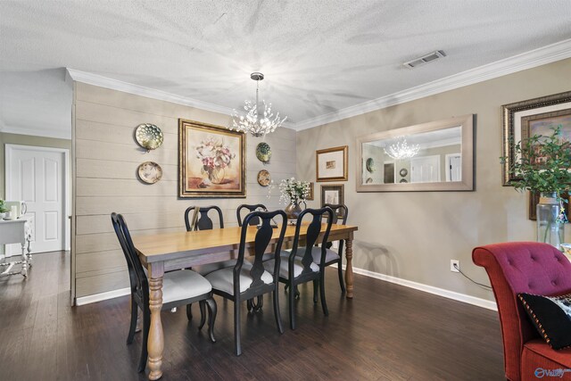 dining space featuring crown molding, dark wood-style flooring, baseboards, visible vents, and a notable chandelier