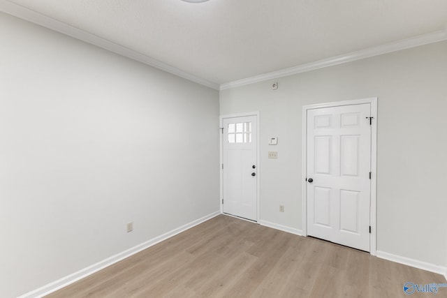 entrance foyer with light wood-type flooring and ornamental molding