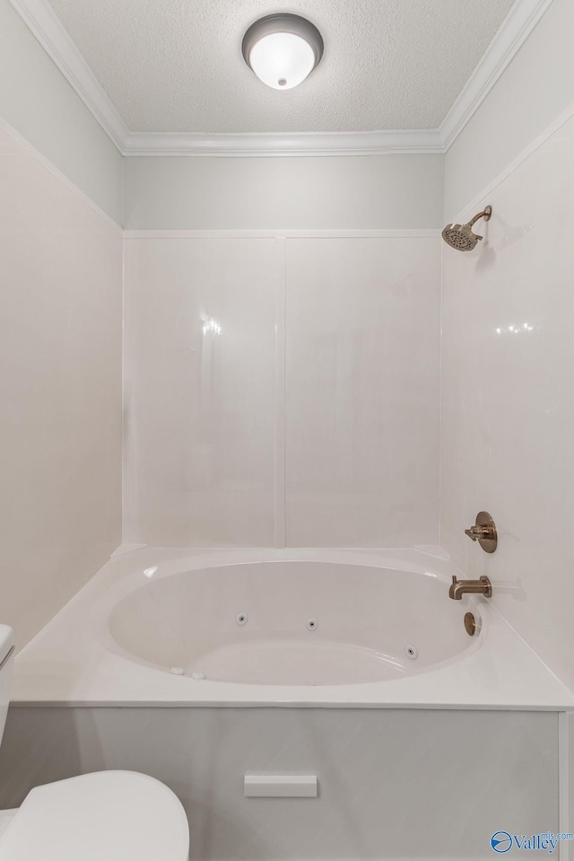 bathroom with bathing tub / shower combination, toilet, a textured ceiling, and ornamental molding