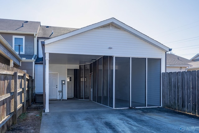 exterior space with a carport