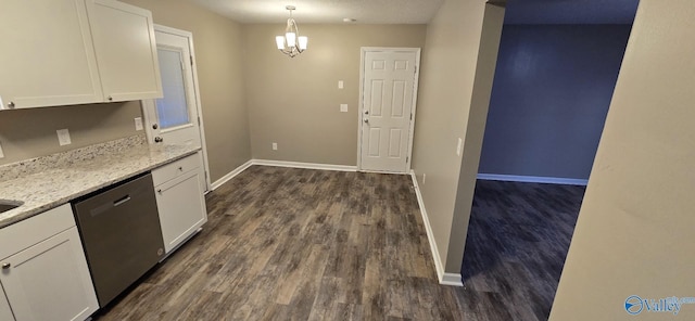 kitchen with white cabinets, dishwasher, pendant lighting, and light stone counters