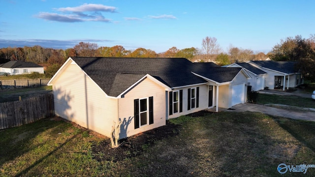 exterior space with a lawn and a garage