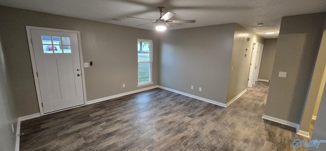 foyer entrance featuring dark hardwood / wood-style floors, ceiling fan, and a textured ceiling