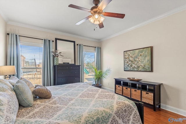 bedroom featuring baseboards, ceiling fan, wood finished floors, and crown molding