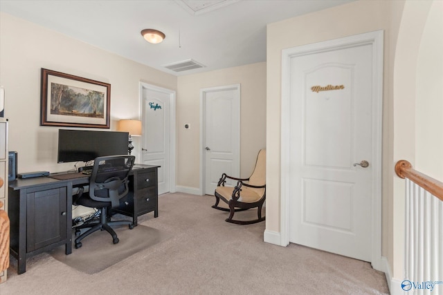 home office featuring light carpet, attic access, visible vents, and baseboards