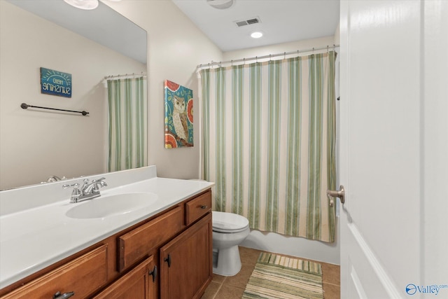 full bathroom with toilet, visible vents, vanity, tile patterned floors, and shower / bath combo