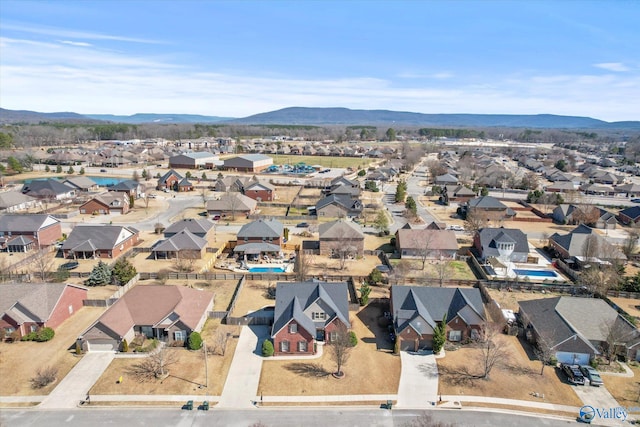 drone / aerial view featuring a residential view and a mountain view