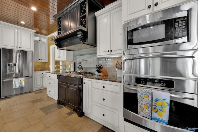 900 Menominee Rd, Langston, AL 35755 - kitchen featuring stainless steel appliances, dark stone countertops, wooden ceiling, decorative backsplash, and white cabinets
