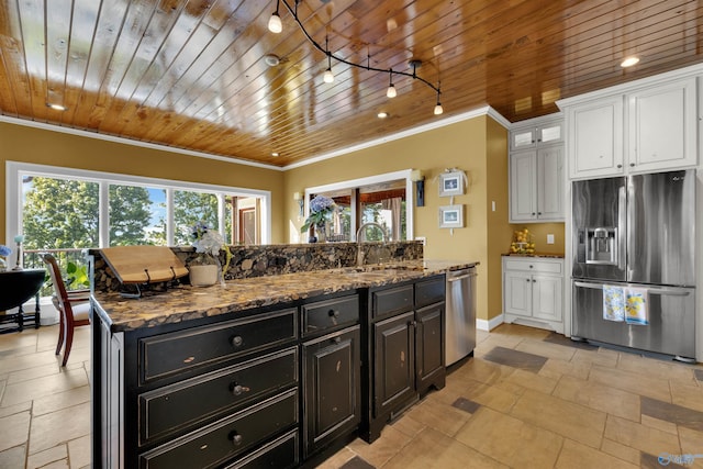 900 Menominee Rd, Langston, AL 35755 - kitchen featuring appliances with stainless steel finishes, wood ceiling, crown molding, white cabinets, and a center island with sink