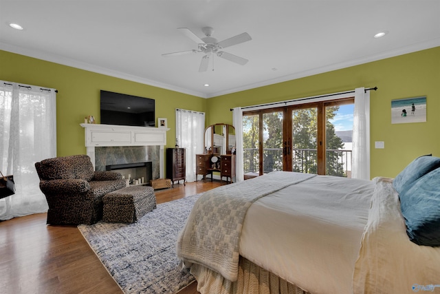 900 Menominee Rd, Langston, AL 35755 - bedroom with crown molding, access to outside, wood finished floors, a high end fireplace, and recessed lighting
