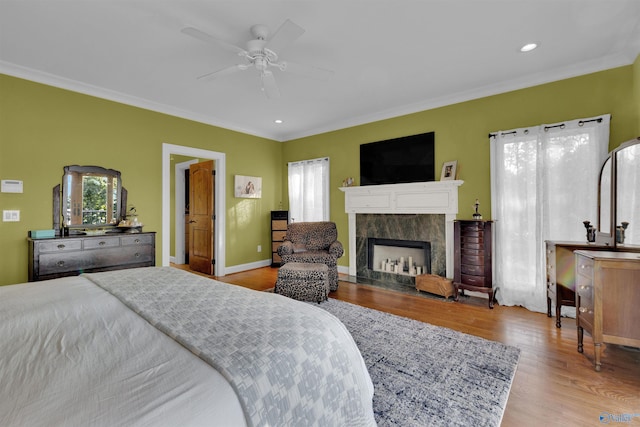 900 Menominee Rd, Langston, AL 35755 - bedroom featuring wood finished floors, ornamental molding, a fireplace, recessed lighting, and ceiling fan