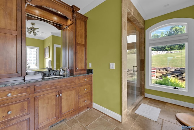 900 Menominee Rd, Langston, AL 35755 - full bathroom with stone tile flooring, plenty of natural light, a stall shower, and ornamental molding
