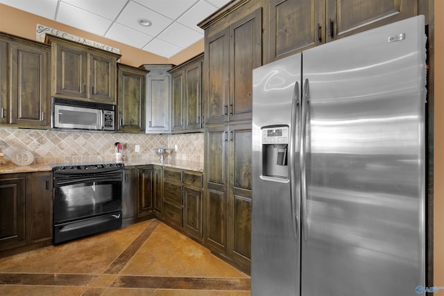 900 Menominee Rd, Langston, AL 35755 - kitchen featuring stainless steel appliances, dark brown cabinets, tasteful backsplash, light stone counters, and a drop ceiling