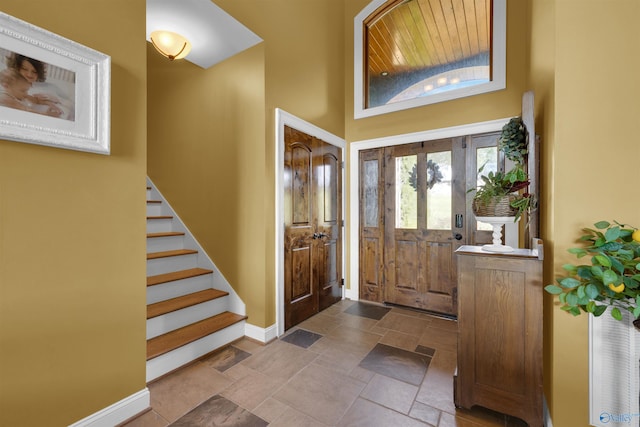 900 Menominee Rd, Langston, AL 35755 - foyer featuring stone tile floors, stairs, and a high ceiling
