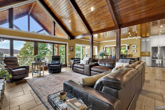 900 Menominee Rd, Langston, AL 35755 - living room featuring a wooden ceiling with exposed beams, healthy amount of natural light, high vaulted ceiling, stone tile floors, and recessed lighting