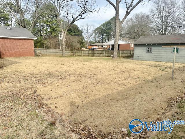 view of yard with fence