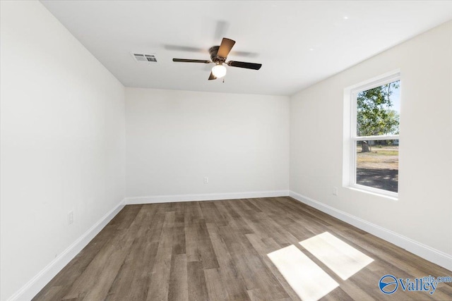 spare room with wood-type flooring and ceiling fan