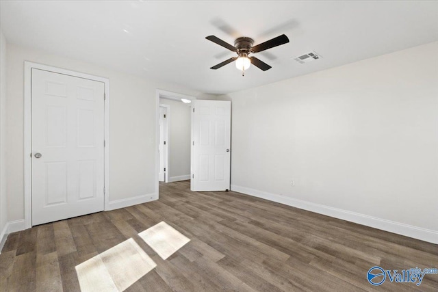 unfurnished bedroom with hardwood / wood-style flooring and ceiling fan