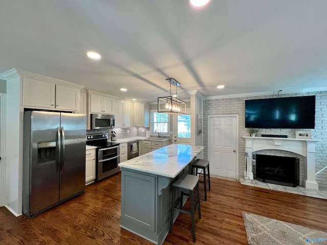 kitchen featuring white cabinetry, stainless steel appliances, and dark wood-type flooring