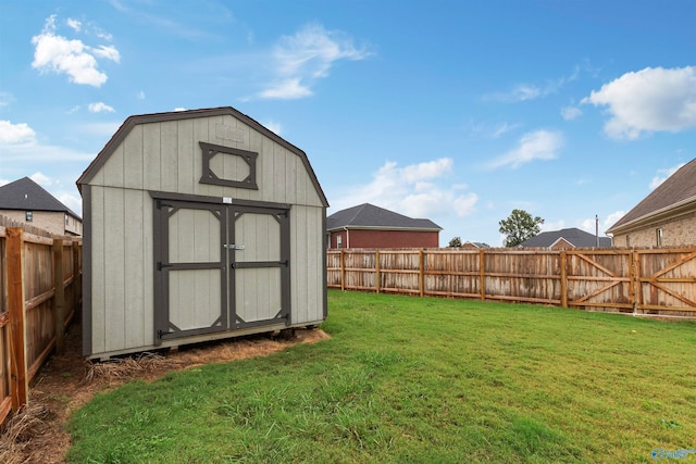 view of outbuilding with a yard