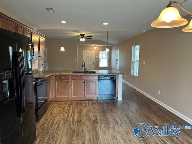 134 Winstead Cir, Owens Cross Roads, AL 35763 - kitchen featuring dark wood finished floors, a sink, ceiling fan, a peninsula, and black appliances