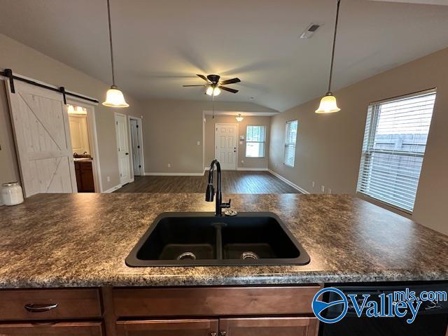 134 Winstead Cir, Owens Cross Roads, AL 35763 - kitchen featuring visible vents, dark countertops, a ceiling fan, a sink, and open floor plan
