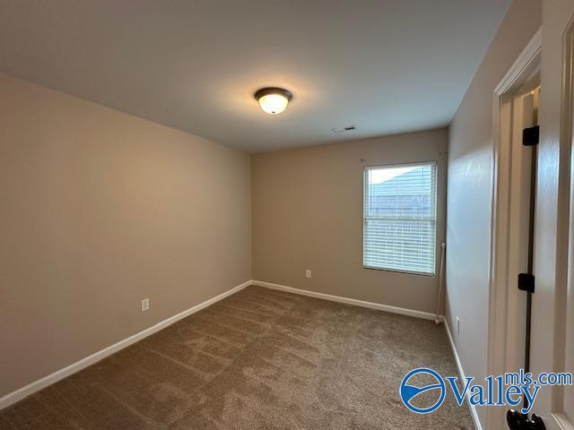 134 Winstead Cir, Owens Cross Roads, AL 35763 - interior space with baseboards and carpet floors