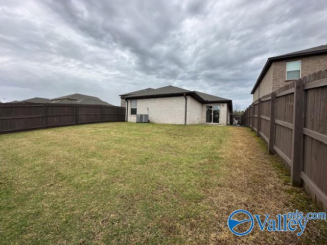134 Winstead Cir, Owens Cross Roads, AL 35763 - view of yard with a fenced backyard and cooling unit